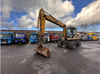 Pelle sur pneus CAT M 315: photos 1
