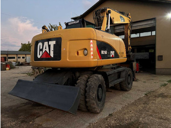 Pelle sur pneus Caterpillar M316D: photos 2