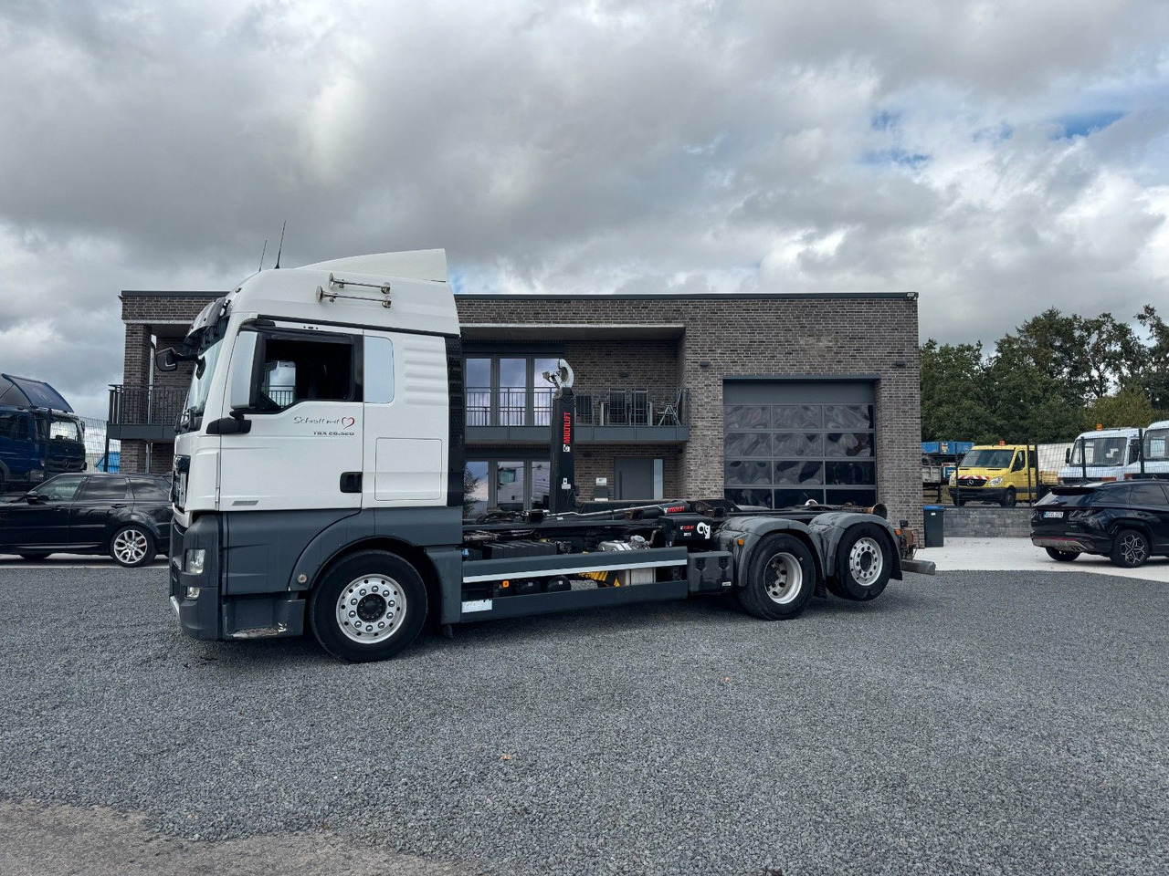 MAN TGX 26.520 D38 Abrollkipper Multilift - Camion ampliroll: photos 1 MAN TGX 26.520 D38 Abrollkipper Multilift - Camion ampliroll: photos 1