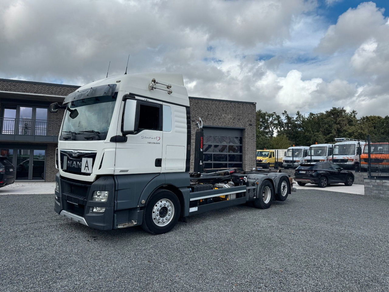 MAN TGX 26.520 D38 Abrollkipper Multilift - Camion ampliroll: photos 2 MAN TGX 26.520 D38 Abrollkipper Multilift - Camion ampliroll: photos 2