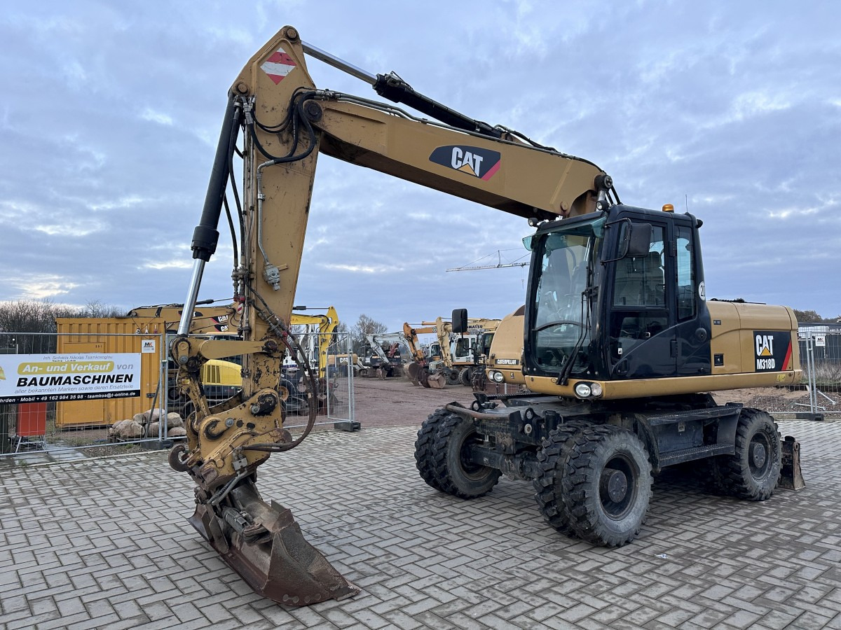 CATERPILLAR M 318 D full Hydr. Top Zustand German machine ! - Pelle sur pneus: photos 4 CATERPILLAR M 318 D full Hydr. Top Zustand German machine ! - Pelle sur pneus: photos 4