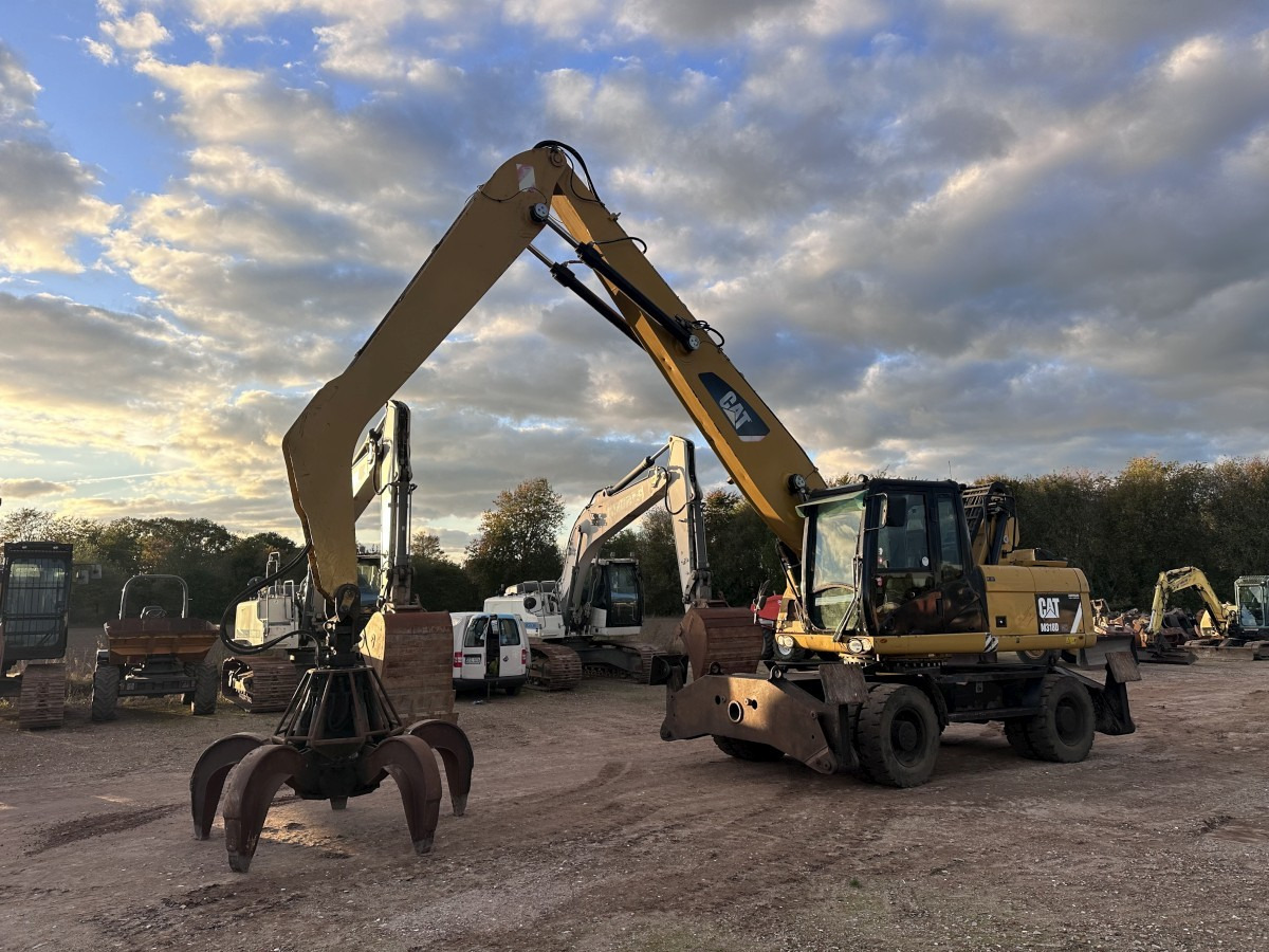 CATERPILLAR M 318 MH mit Greifer Kein 3022 3026 320 322 - Pelle sur pneus: photos 1 CATERPILLAR M 318 MH mit Greifer Kein 3022 3026 320 322 - Pelle sur pneus: photos 1