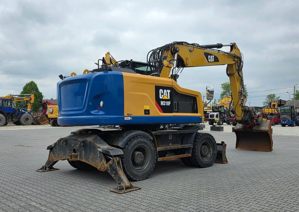 Caterpillar M318F, 2018 ROK, PODPORY + PŁUG, ROTOTILT - Pelle sur pneus: photos 5 Caterpillar M318F, 2018 ROK, PODPORY + PŁUG, ROTOTILT - Pelle sur pneus: photos 5