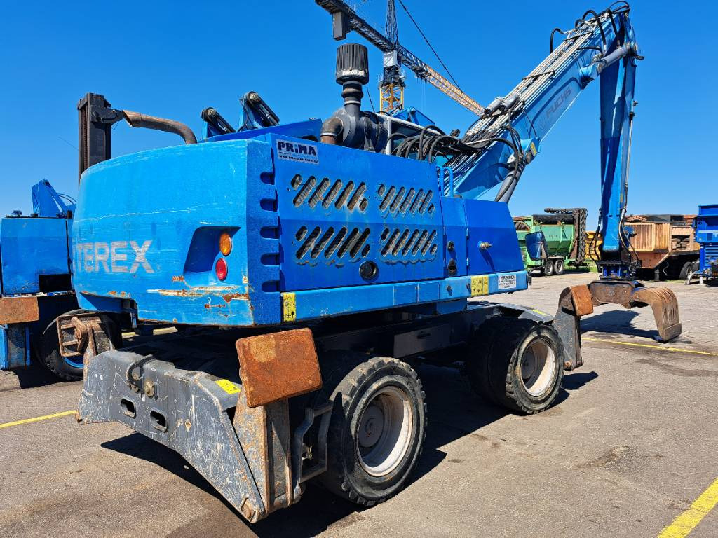 Fuchs MHL331E + Grapple - Pelle de manutention: photos 1 Fuchs MHL331E + Grapple - Pelle de manutention: photos 1