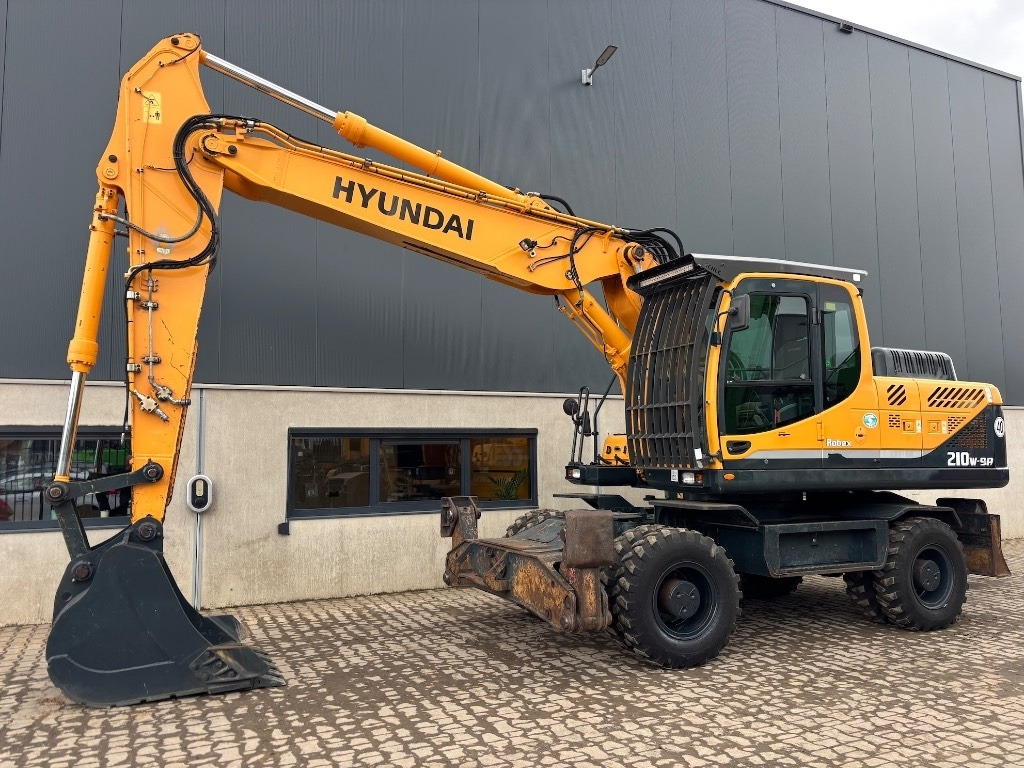 Hyundai Robex 210 W-9 A - 210 W - 200 W - 180 W - Pelle sur pneus: photos 1 Hyundai Robex 210 W-9 A - 210 W - 200 W - 180 W - Pelle sur pneus: photos 1