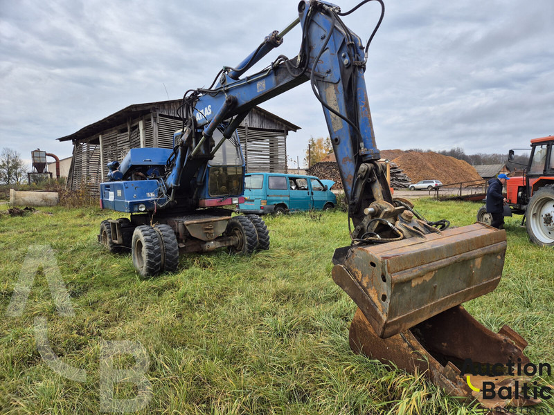 Atlas 1304 - Pelle sur pneus: photos 2 Atlas 1304 - Pelle sur pneus: photos 2