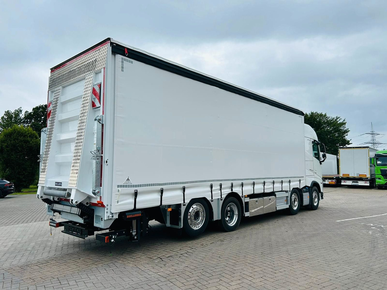 Volvo FH 500 Gabelstaplertransporter LBW Dhollandia 9t - Camion: photos 1 Volvo FH 500 Gabelstaplertransporter LBW Dhollandia 9t - Camion: photos 1
