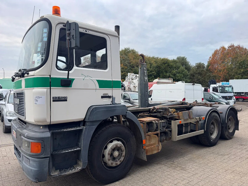 MAN 33.403 **BELGIAN TRUCK-FULL STEEL-MANUAL PUMP** - Camion ampliroll: photos 1 MAN 33.403 **BELGIAN TRUCK-FULL STEEL-MANUAL PUMP** - Camion ampliroll: photos 1