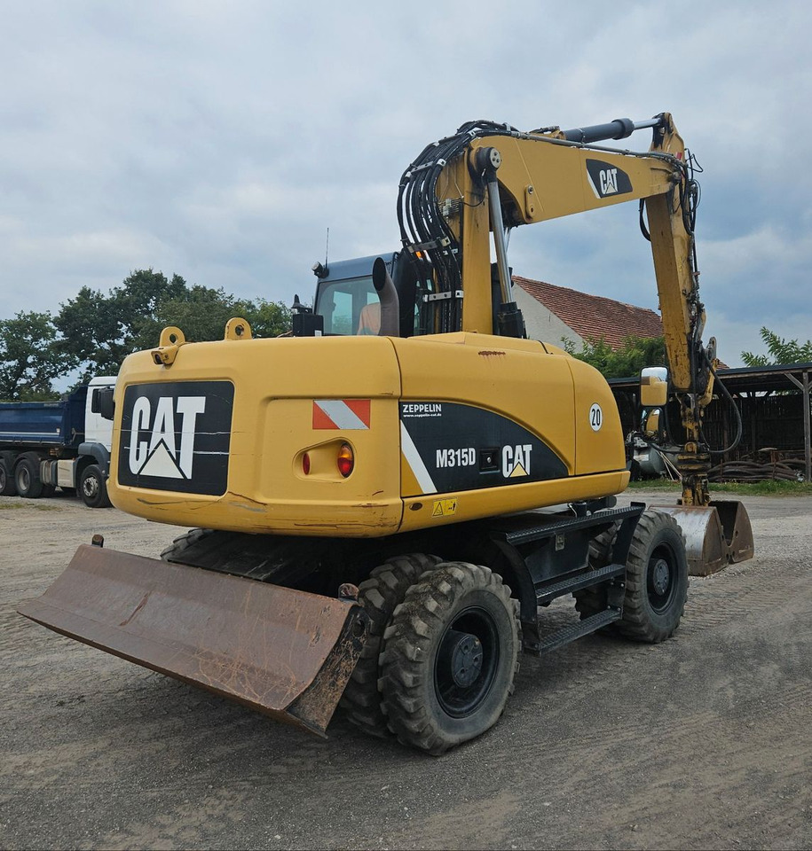 CAT M315D orig. 4.129h - Pelle sur pneus: photos 2 CAT M315D orig. 4.129h - Pelle sur pneus: photos 2
