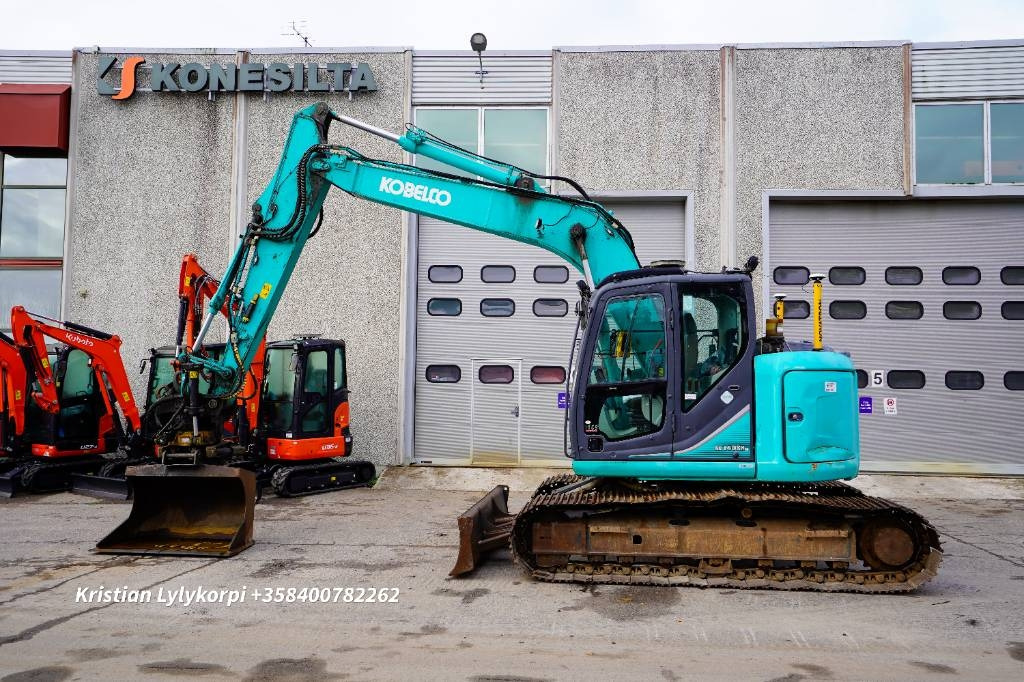 Kobelco SK140SRLC-3 DOZER 3D - Pelle sur chenille: photos 1 Kobelco SK140SRLC-3 DOZER 3D - Pelle sur chenille: photos 1