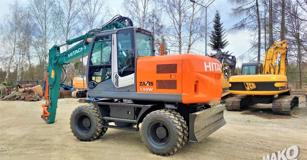 Hitachi ZX140W-3 - Pelle sur pneus: photos 2 Hitachi ZX140W-3 - Pelle sur pneus: photos 2