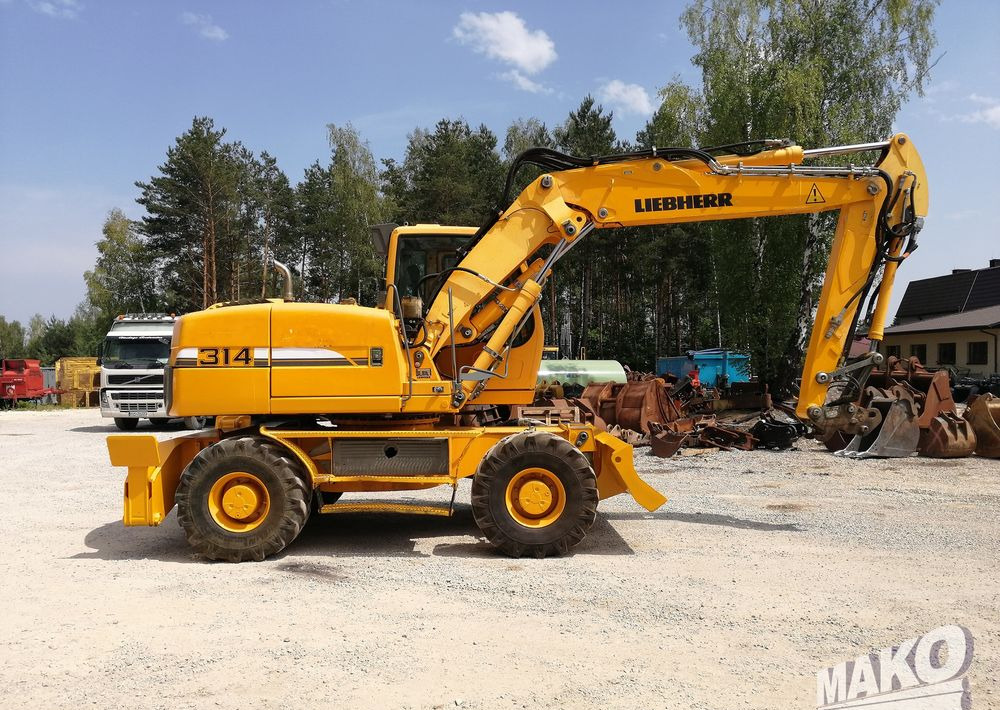 Pelle sur pneus Liebherr A 314 Litronic: photos 6