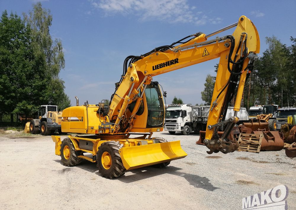Pelle sur pneus Liebherr A 314 Litronic: photos 7