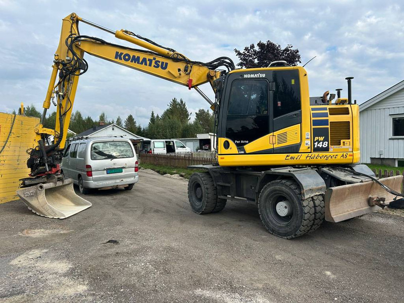 Komatsu PW 148-11 - Pelle sur pneus: photos 1 Komatsu PW 148-11 - Pelle sur pneus: photos 1
