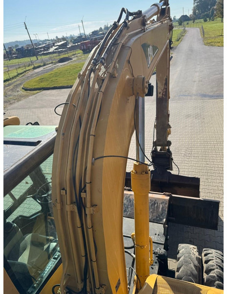 Pelle sur pneus Caterpillar M 316 C: photos 19