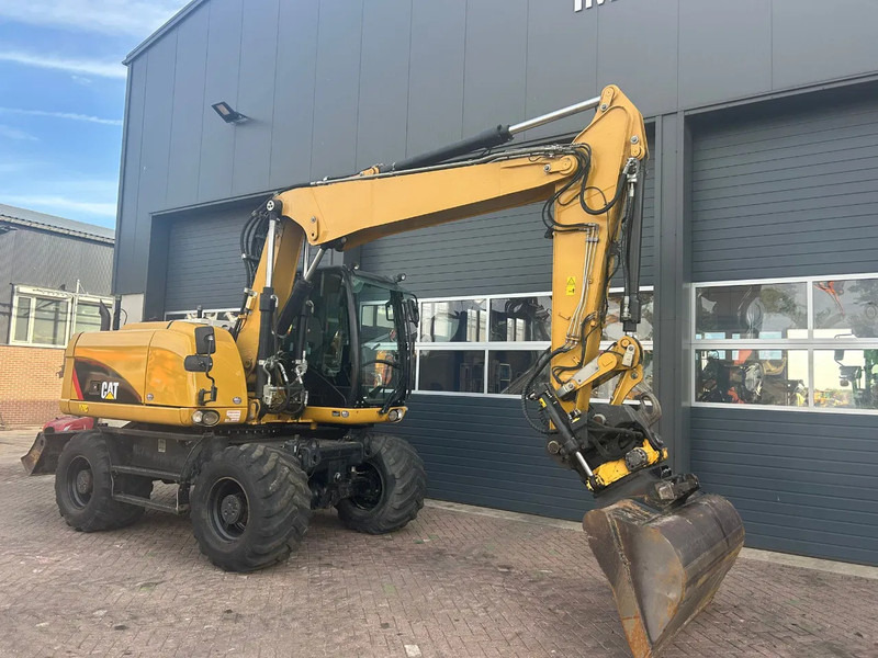 Caterpillar M313D - Pelle sur pneus: photos 3 Caterpillar M313D - Pelle sur pneus: photos 3