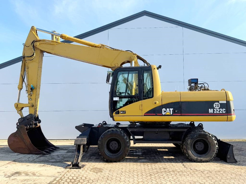 Cat M322C - German Machine / Triple Boom - Pelle sur pneus: photos 1 Cat M322C - German Machine / Triple Boom - Pelle sur pneus: photos 1