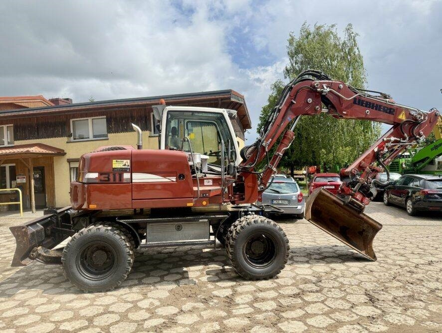 Liebherr A311 Litronic - Pelle sur pneus: photos 1 Liebherr A311 Litronic - Pelle sur pneus: photos 1