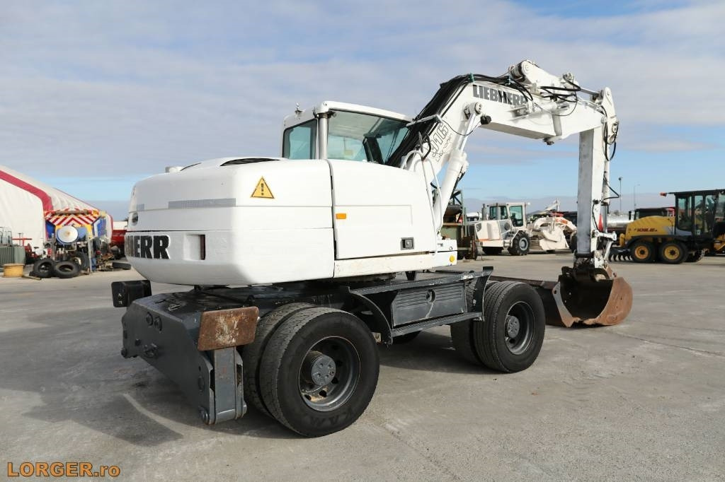 Liebherr A 316 Litronic - Pelle sur pneus: photos 3 Liebherr A 316 Litronic - Pelle sur pneus: photos 3