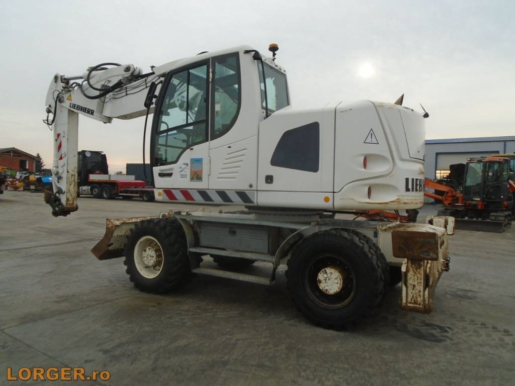 Liebherr A 918 Compact - Pelle sur pneus: photos 2 Liebherr A 918 Compact - Pelle sur pneus: photos 2