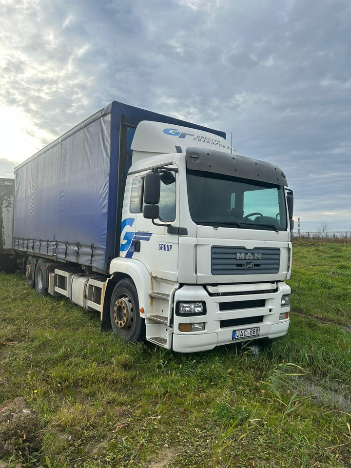 MAN TGA 26.310 - Camion à rideaux coulissants: photos 1 MAN TGA 26.310 - Camion à rideaux coulissants: photos 1