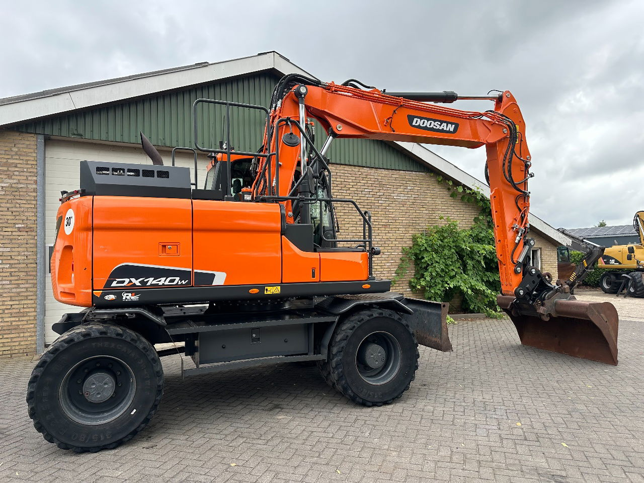 Pelle sur pneus Doosan DX140W-5: photos 7