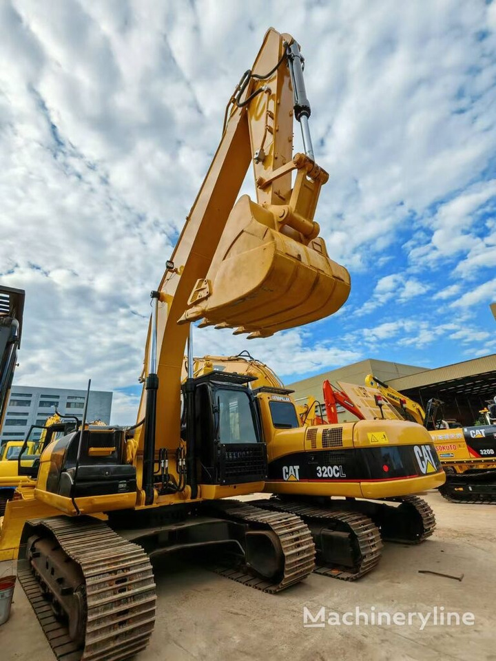 Caterpillar 320CL - Pelle sur pneus: photos 1 Caterpillar 320CL - Pelle sur pneus: photos 1