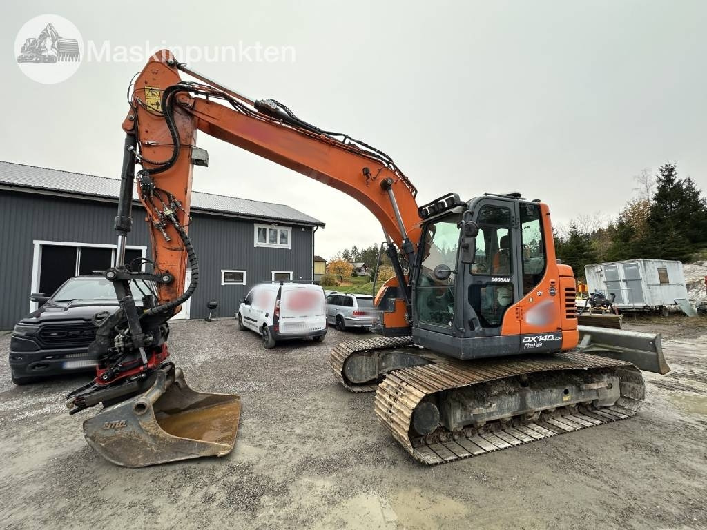 Doosan DX 140 LCR-5 - Pelle sur chenille: photos 1 Doosan DX 140 LCR-5 - Pelle sur chenille: photos 1