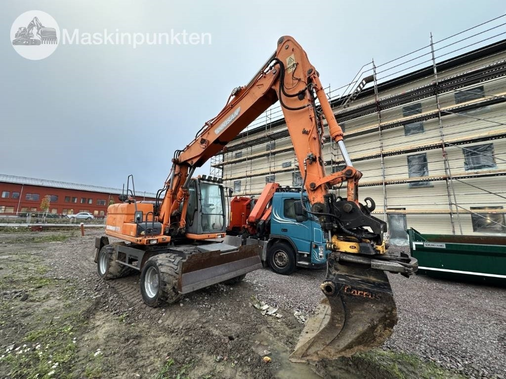 Doosan DX 140 W med vagn och redskap - Pelle sur pneus: photos 2 Doosan DX 140 W med vagn och redskap - Pelle sur pneus: photos 2