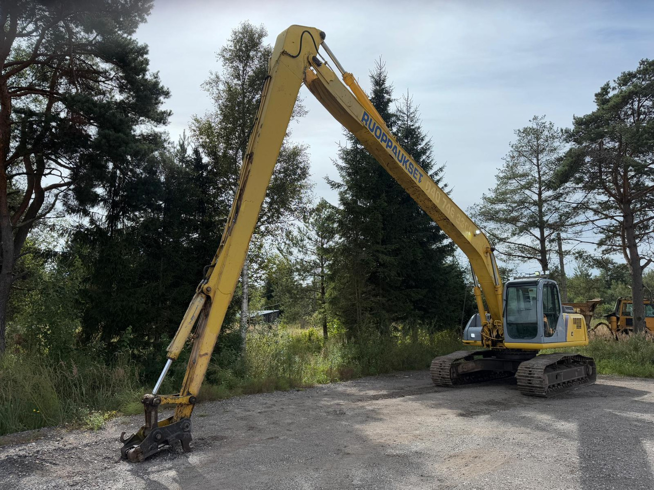 New Holland E 215 - Pelle sur chenille: photos 1 New Holland E 215 - Pelle sur chenille: photos 1