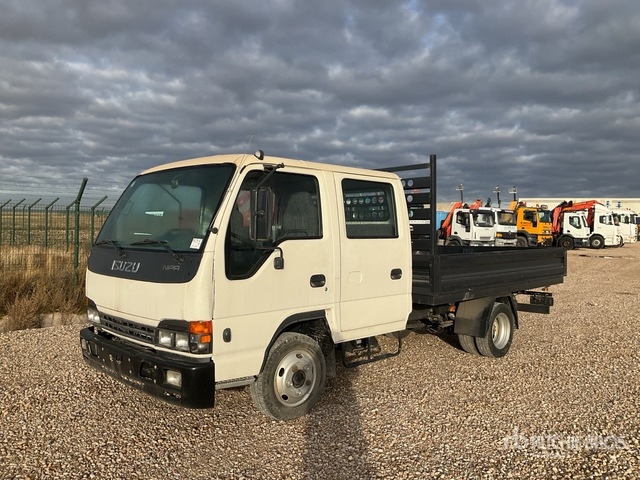2006 Isuzu Elf 4x2 Crew Cab Flatbed Truck - Camion plateau: photos 1 2006 Isuzu Elf 4x2 Crew Cab Flatbed Truck - Camion plateau: photos 1
