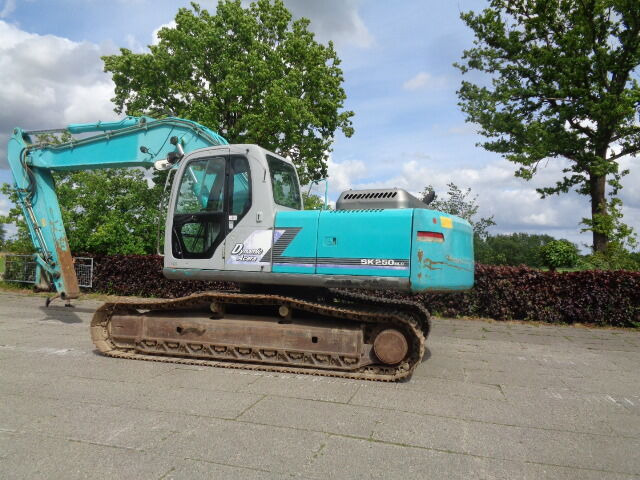 Kobelco SK250NLC - Pelle sur chenille: photos 1 Kobelco SK250NLC - Pelle sur chenille: photos 1