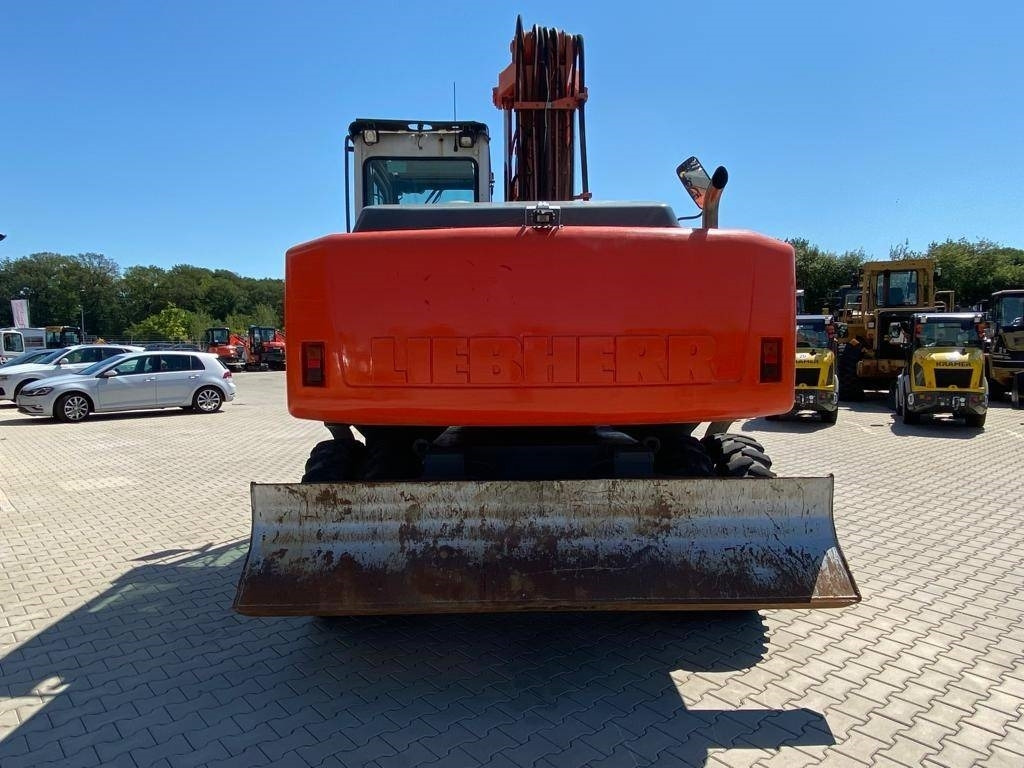 Pelle sur pneus Liebherr A 900 C: photos 6
