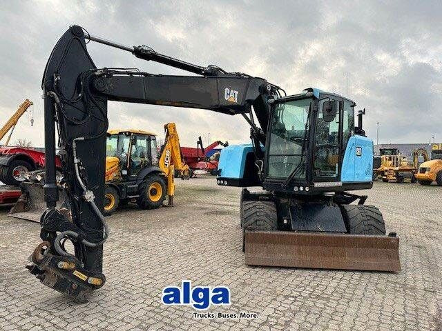 Caterpillar M315F, OilQuick, Hammer- u- Greifersteuerung - Pelle sur pneus: photos 1 Caterpillar M315F, OilQuick, Hammer- u- Greifersteuerung - Pelle sur pneus: photos 1