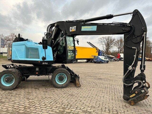 Caterpillar M315F, OilQuick, Hammer- u- Greifersteuerung - Pelle sur pneus: photos 2 Caterpillar M315F, OilQuick, Hammer- u- Greifersteuerung - Pelle sur pneus: photos 2