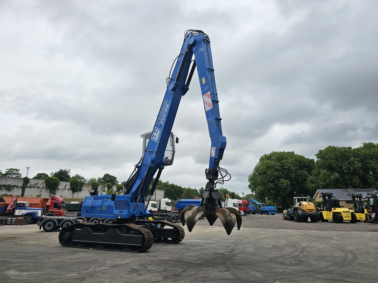 Pelle de manutention Fuchs RHL 350 Materialhandler  With Adjustable Tracks: photos 6