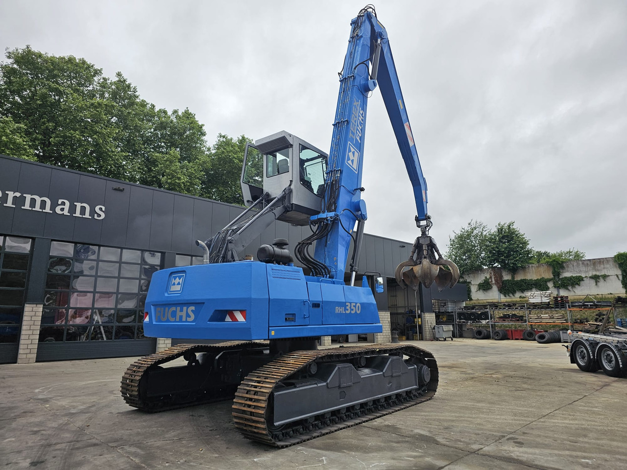 Pelle de manutention Fuchs RHL 350 Materialhandler  With Adjustable Tracks: photos 8