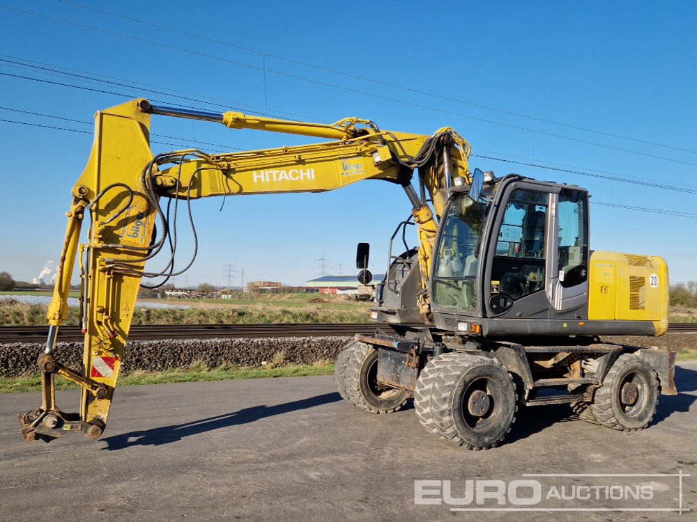 2011 Hitachi ZX170W-3 - Pelle sur pneus: photos 1 2011 Hitachi ZX170W-3 - Pelle sur pneus: photos 1