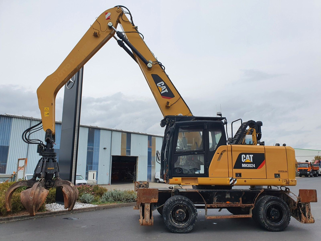 CAT MH3024 / MH 3024 / Greifer / 2018 / 9.424h - Pelle sur pneus: photos 3 CAT MH3024 / MH 3024 / Greifer / 2018 / 9.424h - Pelle sur pneus: photos 3