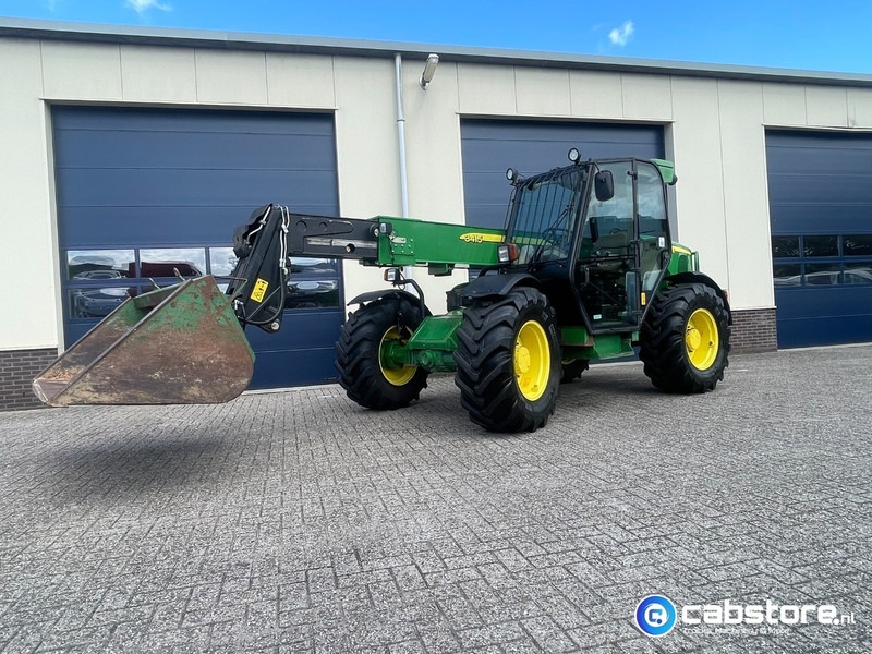 John Deere 3415 Verreiker met vorken en laadschop - Machine agricole: photos 4 John Deere 3415 Verreiker met vorken en laadschop - Machine agricole: photos 4