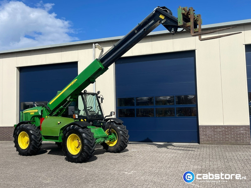 John Deere 3415 Verreiker met vorken en laadschop - Machine agricole: photos 4 John Deere 3415 Verreiker met vorken en laadschop - Machine agricole: photos 4