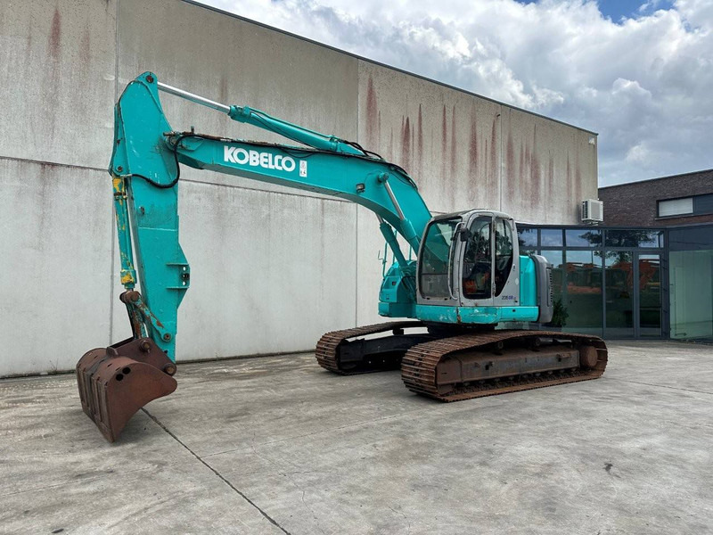 Kobelco SK235SRLC-1E - Pelle sur chenille: photos 1 Kobelco SK235SRLC-1E - Pelle sur chenille: photos 1